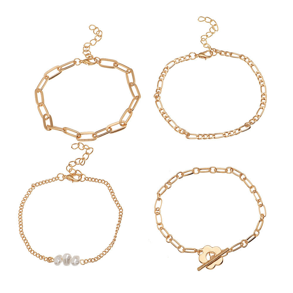 Conjunto de 4 pulseras elegantes doradas