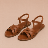 Vera - Sandalias planas con tiras cruzadas y tobillera elástica