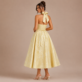 Ángela - Vestido midi halter con lazo y falda voluminosa.