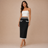 Leticia – falda midi estructurada con detalles en contraste y bolsillos decorativos