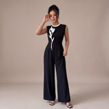 Iria – mono negro con detalle floral en contraste